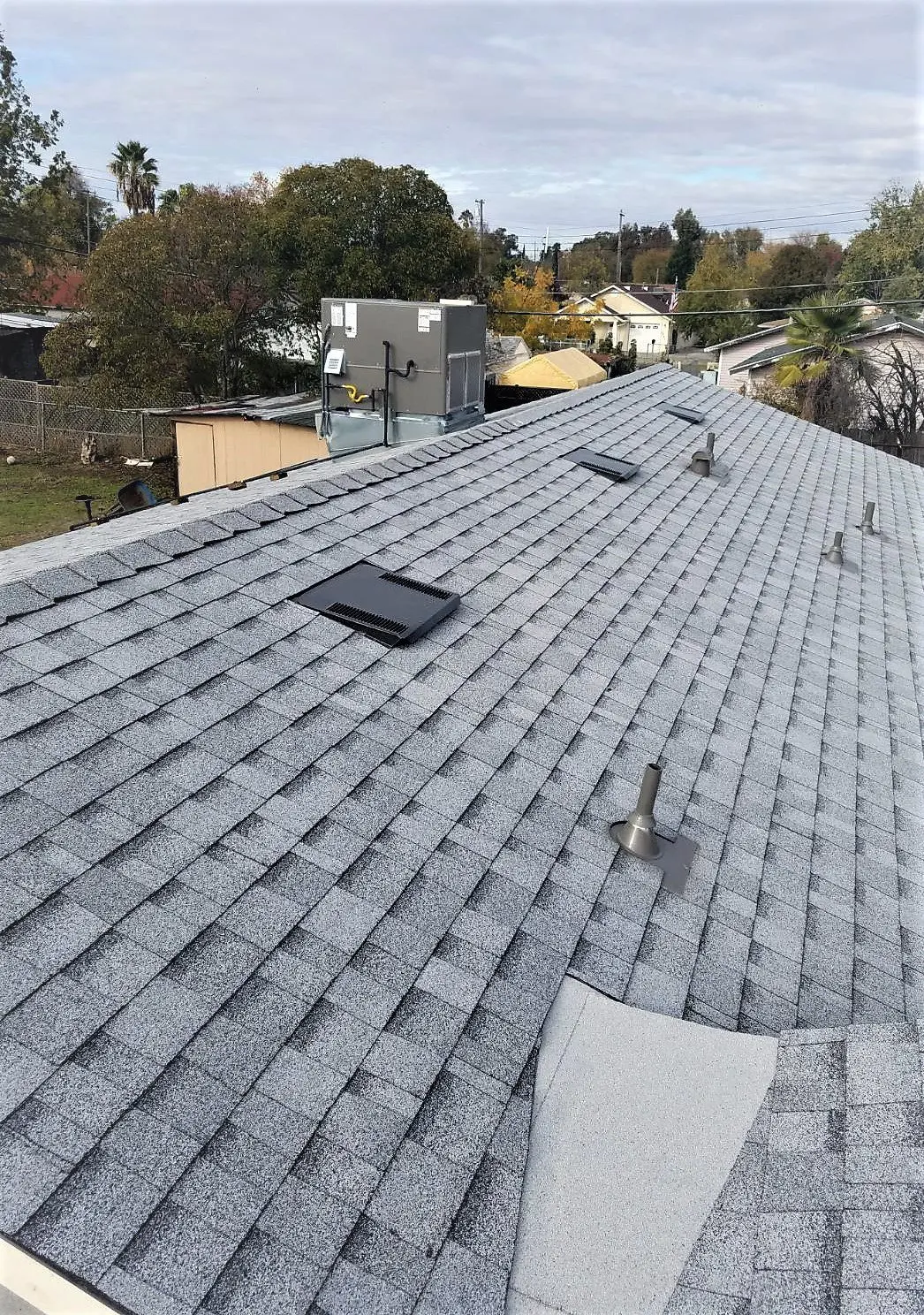 Completed asphalt shingle roofing system