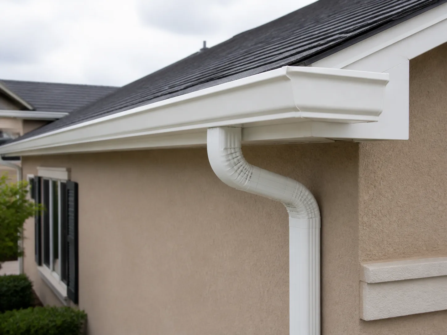 Seamless gutter and downspout installed on a home